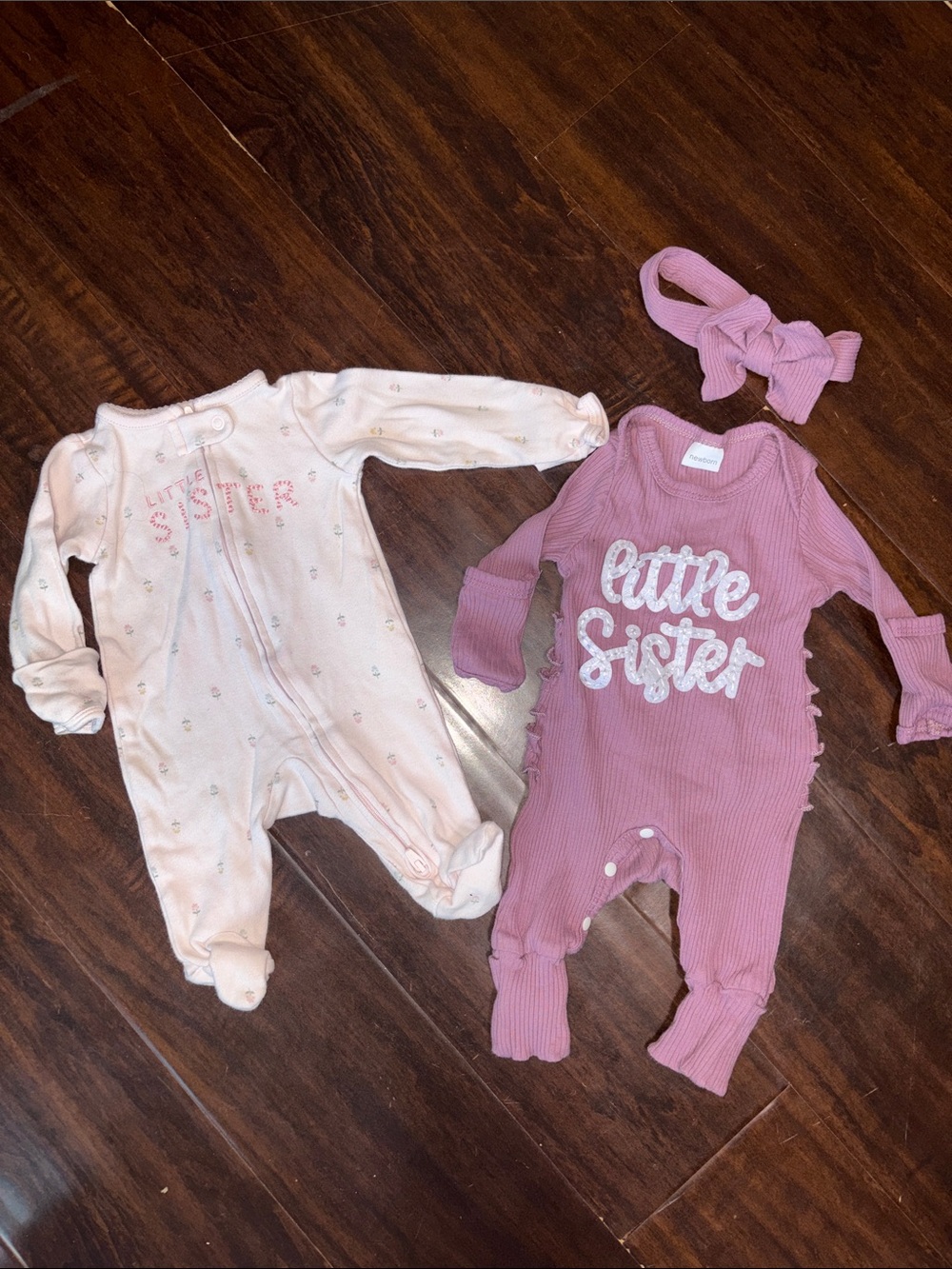 Bundle of “little sister” newborn onesies